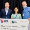 Anika Das pictured with her check